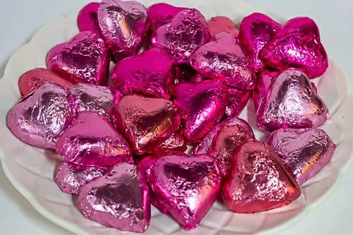 Paul's Confectionery Chocolates - Milk, Dark & White Hearts - Milk Chocolate Hearts In Mixed Pink Foils 1kg