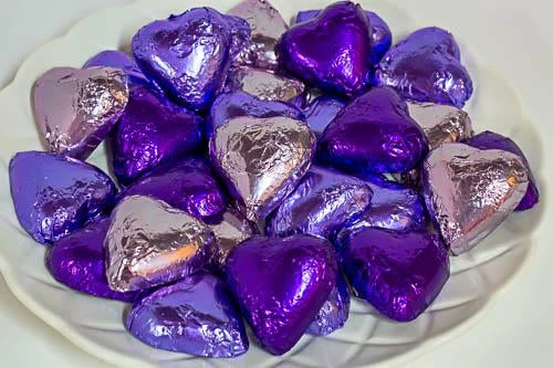 Paul's Confectionery Chocolates - Milk, Dark & White Hearts - Milk Chocolate Hearts In Mixed Purple Foils 1kg