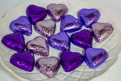 Paul's Confectionery Chocolates - Milk, Dark & White Hearts - Milk Chocolate Hearts In Mixed Purple Foils 1kg